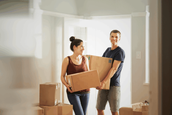 First time home buyers moving into their new home in Newfoundland and Labrador, preparing to protect their property with home insurance