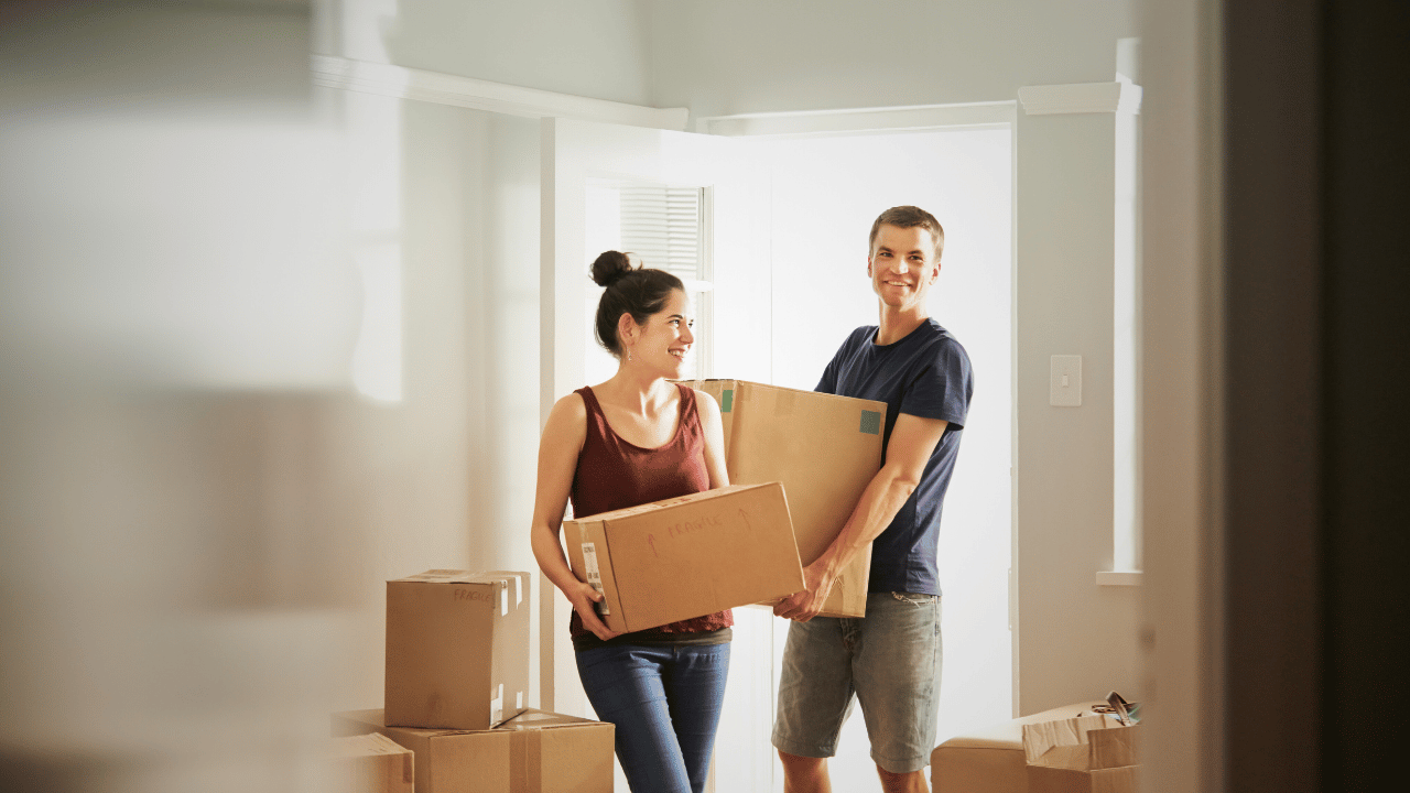 First time home buyers moving into their new home in Newfoundland and Labrador, preparing to protect their property with home insurance
