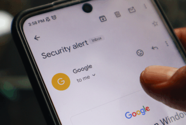 Google security alert email on smartphone screen, illustrating phishing and malware risks in Canada